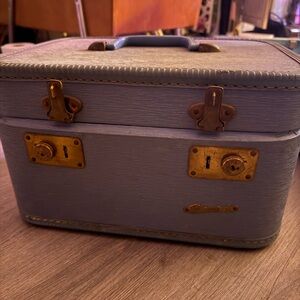 Vintage Blue Suitcase with Gold Accents